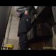 Miss Marilyn squats with her pants down under concrete stairs. No pooping shown. Widescreen format video. Over a minute.